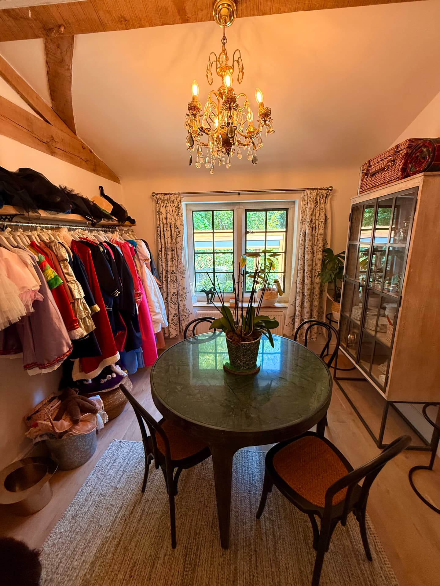 Dining room with chandelier and round table