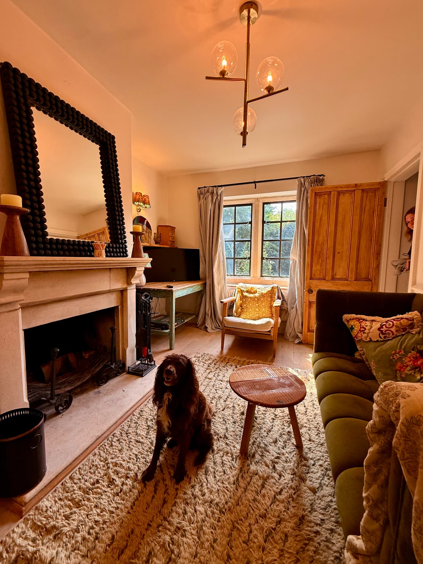 Fireside sitting room with stone mantelpiece